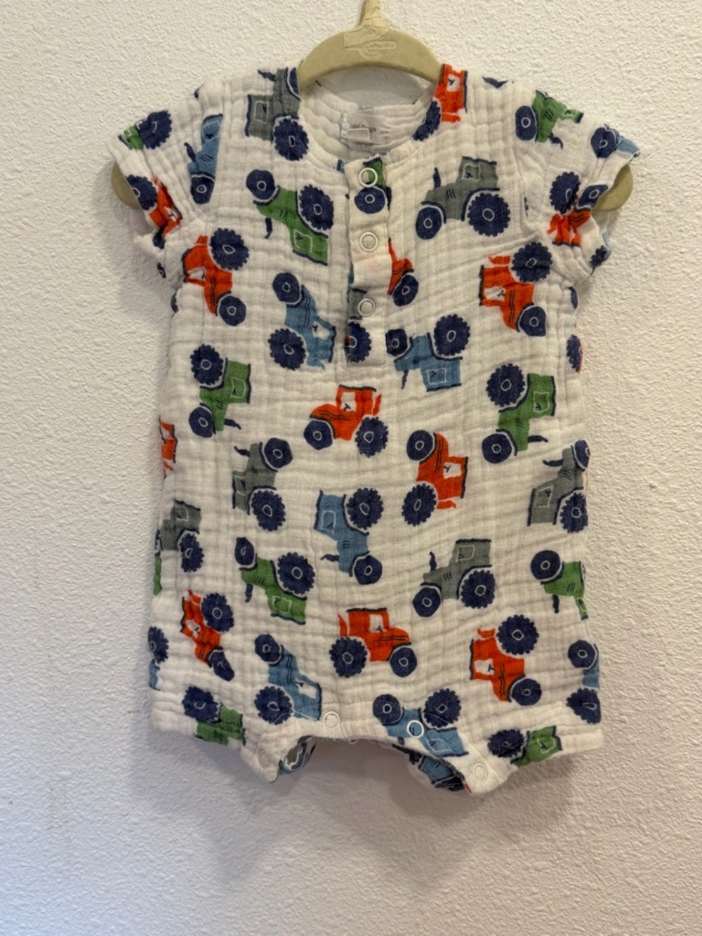 Angel Dear White Muslin Romper with Red Blue and Green Tractor Print